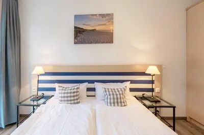 Ein Bett oder Betten in einem Zimmer der Unterkunft Leuchtturm