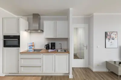 Küche/Küchenzeile in der Unterkunft 5-Sterne-Ferienwohnung - Windflüchter an der Seebrücke