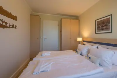 Ein Bett oder Betten in einem Zimmer der Unterkunft Kranichtanz
