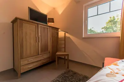Ein Bett oder Betten in einem Zimmer der Unterkunft Hus Rusty