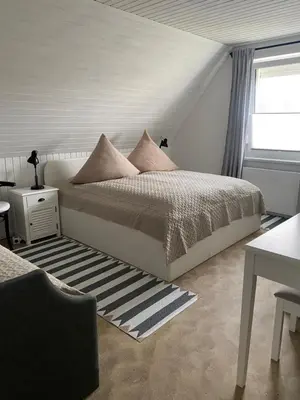 Ein Bett oder Betten in einem Zimmer der Unterkunft Ankerplatz 2