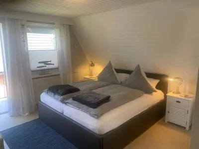 Ein Bett oder Betten in einem Zimmer der Unterkunft Ankerplatz 1