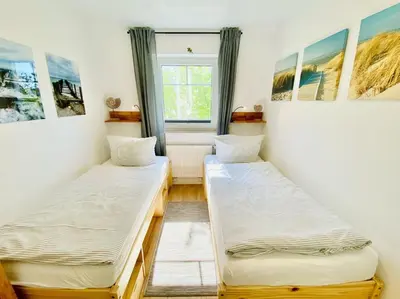 Ein Bett oder Betten in einem Zimmer der Unterkunft Boddenkieker 03