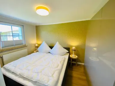 Ein Bett oder Betten in einem Zimmer der Unterkunft Ferienwohnung Sol im idyllischen Pruchten