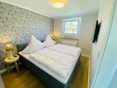 Ein Bett oder Betten in einem Zimmer der Unterkunft Ferienwohnung Watten im idyllischen Pruchten
