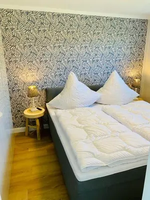 Ein Bett oder Betten in einem Zimmer der Unterkunft Ferienwohnung Watten im idyllischen Pruchten