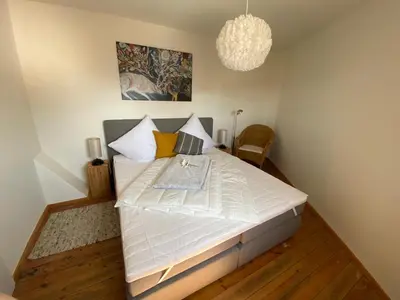 Ein Bett oder Betten in einem Zimmer der Unterkunft Ferienwohnung 