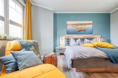Ein Bett oder Betten in einem Zimmer der Unterkunft Strandstraße 16 - Wohnung 3