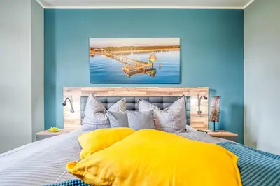 Ein Bett oder Betten in einem Zimmer der Unterkunft Strandstraße 16 - Wohnung 3
