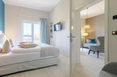 Ein Bett oder Betten in einem Zimmer der Unterkunft Columbus Suite