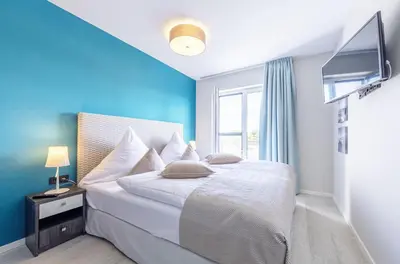 Ein Bett oder Betten in einem Zimmer der Unterkunft Boddensonne