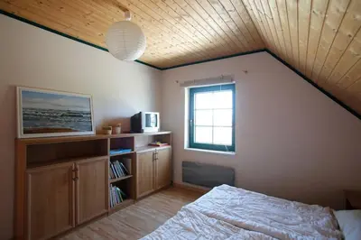 Ein Bett oder Betten in einem Zimmer der Unterkunft TROLLHUS - Großes familienfreundliches Ferienhaus