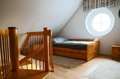 Ein Bett oder Betten in einem Zimmer der Unterkunft Boddenkieker 15