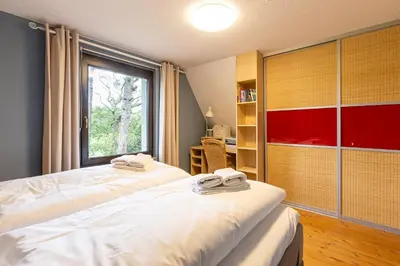 Ein Bett oder Betten in einem Zimmer der Unterkunft Grüne Düne