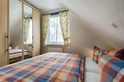 Ein Bett oder Betten in einem Zimmer der Unterkunft Buchengrund Whg 8