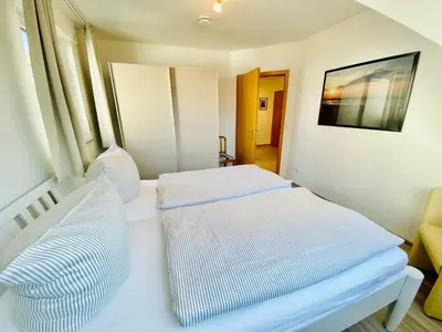 Ein Bett oder Betten in einem Zimmer der Unterkunft Boddenkieker 04