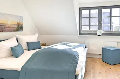 Ein Bett oder Betten in einem Zimmer der Unterkunft InselLeben
