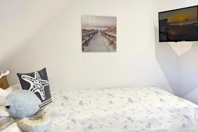 Ein Bett oder Betten in einem Zimmer der Unterkunft InselLeben
