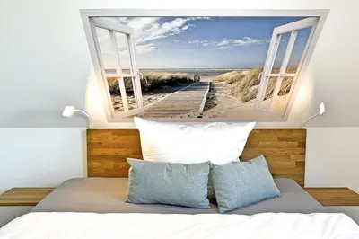 Ein Bett oder Betten in einem Zimmer der Unterkunft InselLeben