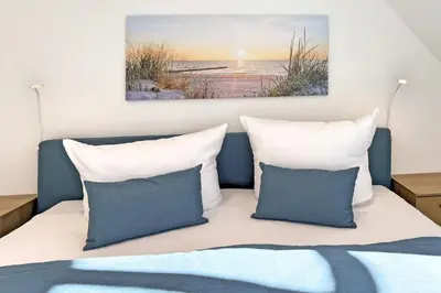 Ein Bett oder Betten in einem Zimmer der Unterkunft InselLeben