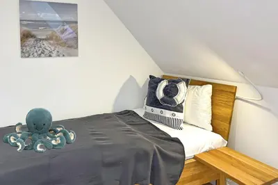 Ein Bett oder Betten in einem Zimmer der Unterkunft InselLeben