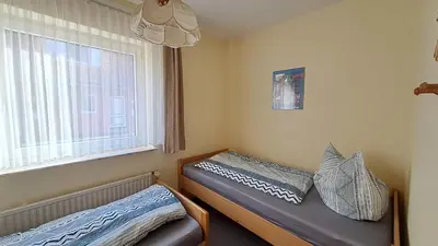 Ein Bett oder Betten in einem Zimmer der Unterkunft Apartment Prerower Straße