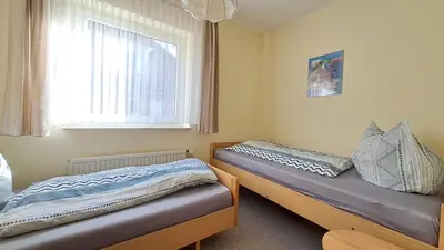 Ein Bett oder Betten in einem Zimmer der Unterkunft Apartment Prerower Straße