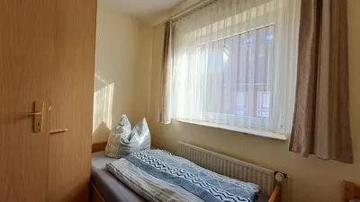 Ein Bett oder Betten in einem Zimmer der Unterkunft Apartment Prerower Straße