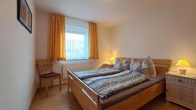 Ein Bett oder Betten in einem Zimmer der Unterkunft Apartment Hoppenberg