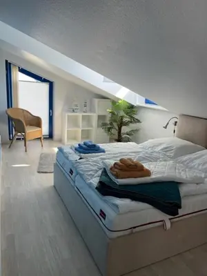 Ein Bett oder Betten in einem Zimmer der Unterkunft Bodden-Adler