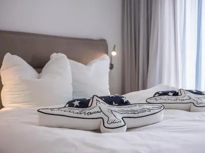 Ein Bett oder Betten in einem Zimmer der Unterkunft Villa Baltic Zingst - AP Strandfein