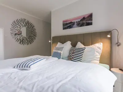 Ein Bett oder Betten in einem Zimmer der Unterkunft Villa Baltic Zingst - AP Strandfein