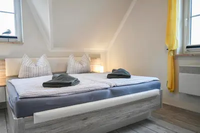 Ein Bett oder Betten in einem Zimmer der Unterkunft Falke - der Ostsee so nah