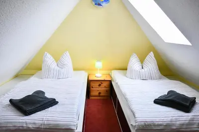 Ein Bett oder Betten in einem Zimmer der Unterkunft Falke - der Ostsee so nah