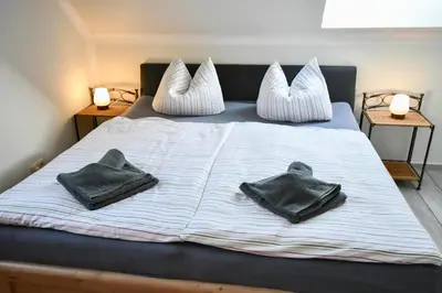 Ein Bett oder Betten in einem Zimmer der Unterkunft Falke - der Ostsee so nah