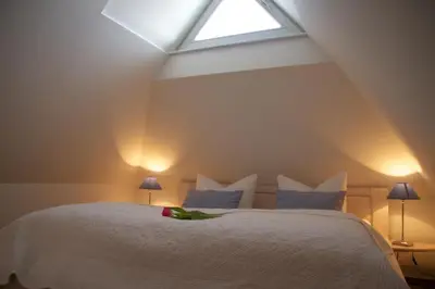 Ein Bett oder Betten in einem Zimmer der Unterkunft Am Trommelplatz - Ferienwohnung 3