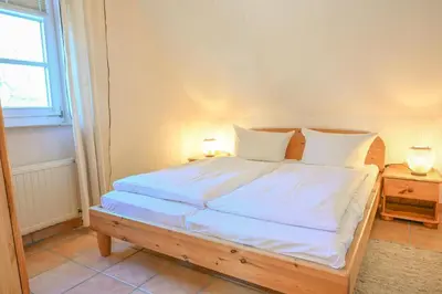 Ein Bett oder Betten in einem Zimmer der Unterkunft FH Tannenwieck - Austernfischer OG