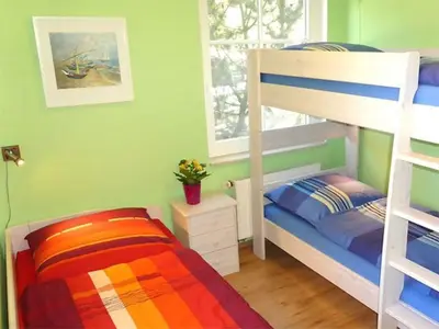 Ein Bett oder Betten in einem Zimmer der Unterkunft Boddenparadies - Baltija