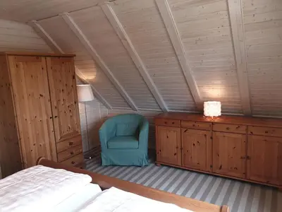 Ein Bett oder Betten in einem Zimmer der Unterkunft Blockhaus - de lüt holt hus