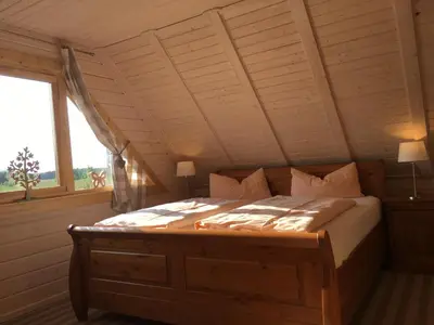 Ein Bett oder Betten in einem Zimmer der Unterkunft Blockhaus - de lüt holt hus