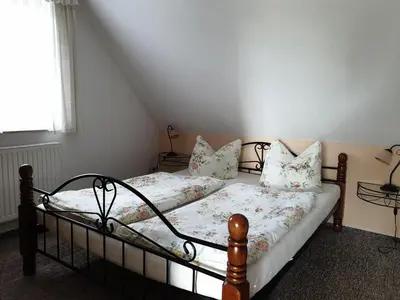 Ein Bett oder Betten in einem Zimmer der Unterkunft Buhne II OG
