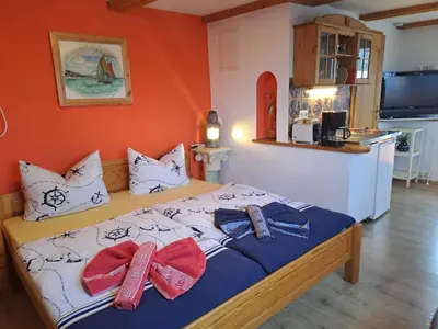 Ein Bett oder Betten in einem Zimmer der Unterkunft Darß Stuv