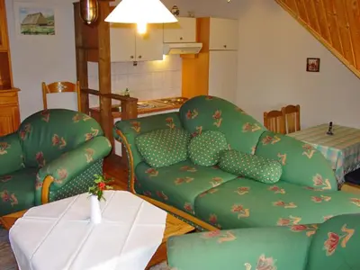 Ein Sitzbereich in der Unterkunft Pension Martens - Gaubenwohnung