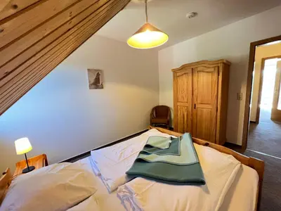 Ein Bett oder Betten in einem Zimmer der Unterkunft Pension Martens - Katja