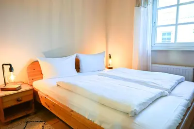 Ein Bett oder Betten in einem Zimmer der Unterkunft FH Tannenwieck - FH Tannenwieck Ferienwohnung Kormoran EG