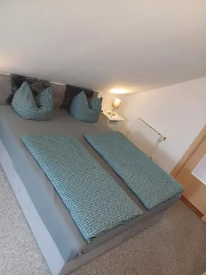 Ein Bett oder Betten in einem Zimmer der Unterkunft Kranich