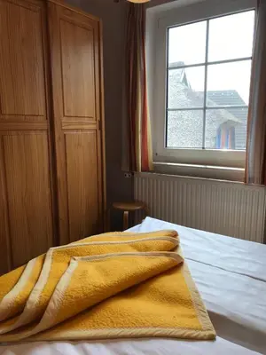 Ein Bett oder Betten in einem Zimmer der Unterkunft Pension Martens - Lotte