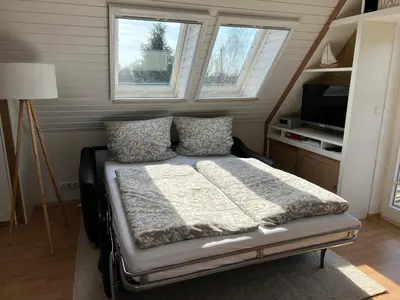 Ein Bett oder Betten in einem Zimmer der Unterkunft FH Tannenwieck - FH Tannenwieck Ferienwohnung Seeadler DG