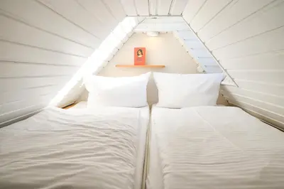 Ein Bett oder Betten in einem Zimmer der Unterkunft FH Tannenwieck - FH Tannenwieck Ferienwohnung Seeadler DG
