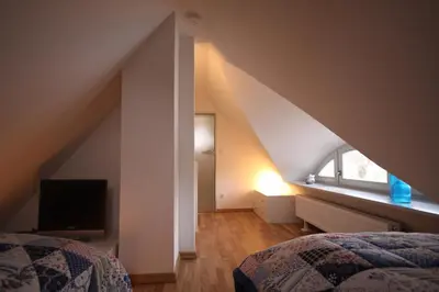 Ein Bett oder Betten in einem Zimmer der Unterkunft Am Trommelplatz - Wolke 7